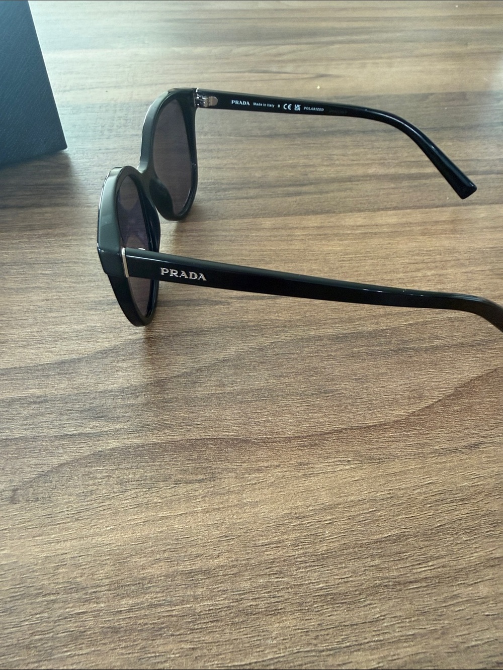 Prada Woman’s Black Frame Sunglasses with Dark Lenses - Picture 4 of 4